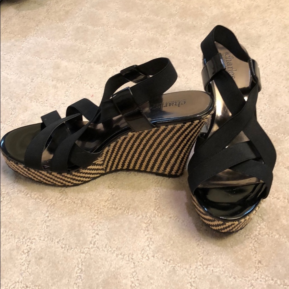 Black and beige wedge heels.